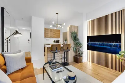 a living room with a couch and a table at The Sherbrooke Suite 99 in Montréal