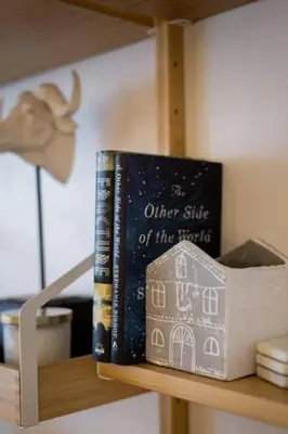 a couple of books sitting on a shelf at The Sherbrooke Suite 103 in Montréal