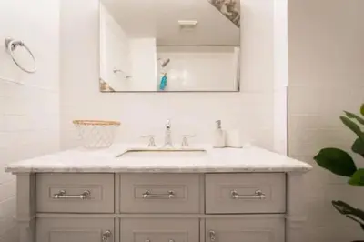 a bathroom with a sink and a mirror at The Sherbrooke Suite 102 in Montréal