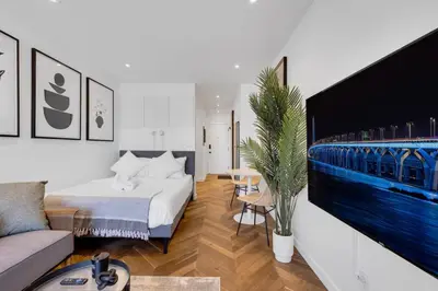 a hotel room with a bed and a couch at The Speakeasy Suite 502 With Parking in Montréal