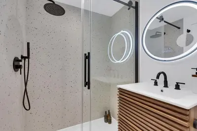a bathroom with a shower and a sink at The Speakeasy Suite 502 With Parking in Montréal