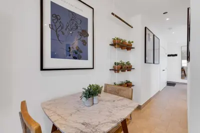 a dining room with a marble table and chairs at The Speakeasy Suite 501 With Parking in Montréal