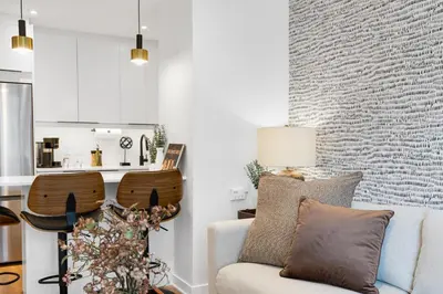 a living room with a couch and a table at Atelier Montreal Luxe 1BR King Bed With Parking in Montréal