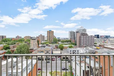 a view of a city from a balcony at Downtown Montreal Horizon Suite With Parking in Montréal