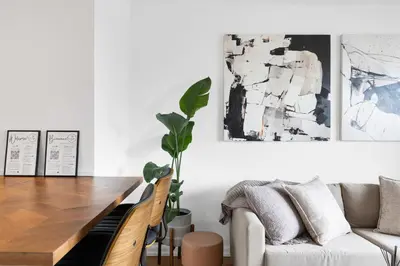 a living room with a table and a couch at Downtown Montreal Horizon Suite With Parking in Montréal