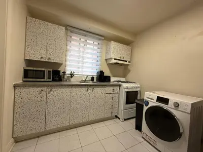 a kitchen with a microwave and a dishwasher at Delightful Style & Comfort in Montreal! Sleep 4! in Montréal