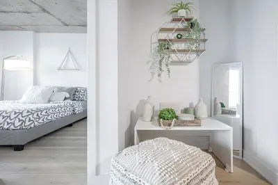 a white bedroom with a bed and a table at Cozy Oasis Home Downtown Montreal - Free Indoor Parking-In Suite Laundry in Montréal