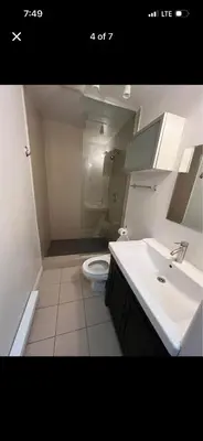 a bathroom with a white sink and a toilet at Mont roamyal in Montréal