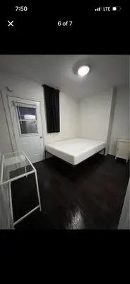 a small room with a bed and a window at Mont roamyal in Montréal