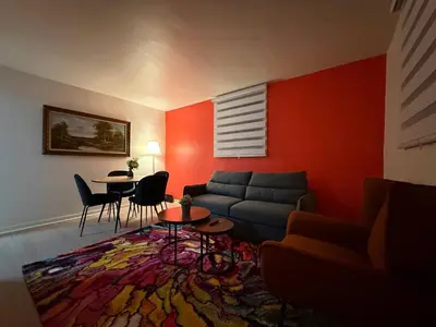 a living room with a couch and a table at Lovely Vacation Home 2BR in MTL! in Montréal