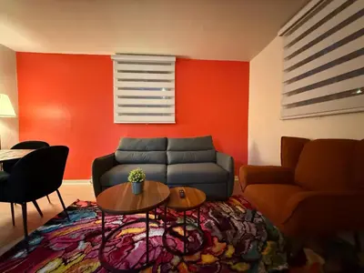a living room with a couch and a table at Lovely Vacation Home 2BR in MTL! in Montréal