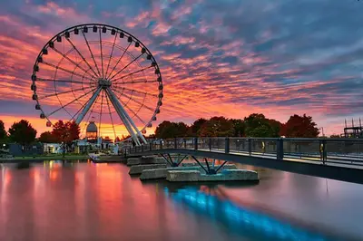 a ferris wheel on a bridge over a river at Free Parking! Montreal Adventure Home - Modern & Spacious Comforts! in Montréal