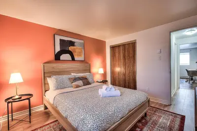 a bedroom with a bed with a stuffed animal on it at Free Parking! Montreal Adventure Home - Modern & Spacious Comforts! in Montréal