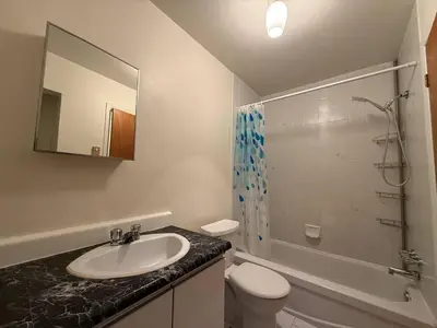 a bathroom with a sink and a toilet and a shower at Free Parking! Family & Travel Comforts! Montreal & Downtown Adventures! in Montréal