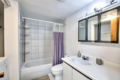 a bathroom with a sink and a toilet and a shower at Free Parking! Family & Travel Comforts! Montreal & Downtown Adventures! in Montréal