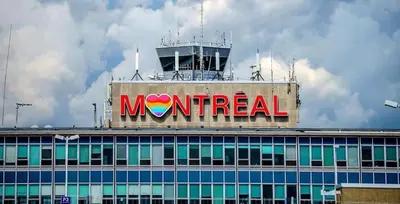 a mnet sign on the top of a building at Free Parking! Family & Travel Comforts! Montreal & Downtown Adventures! in Montréal
