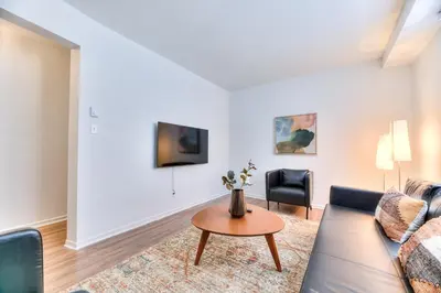 a living room with a couch and a table at NDG & Montreal getaway in Montréal