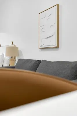a bedroom with a bed and a picture on the wall at Le Mistral Modern Studios in Montréal