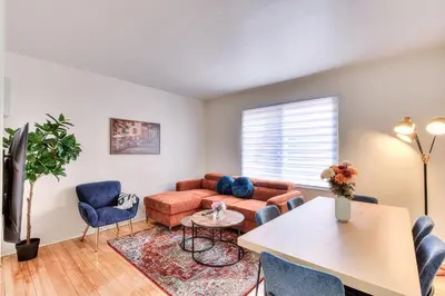 a living room with a couch and a table at NDG Montreal! Attractions & Downtown Adventure Travels! Family, Friends, Work-travel! in Montréal