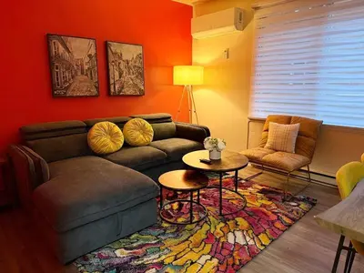 a living room with a couch and a table at NDG Montreal! Attractions & Downtown Adventure Travels! Family, Friends, Work-travel! in Montréal