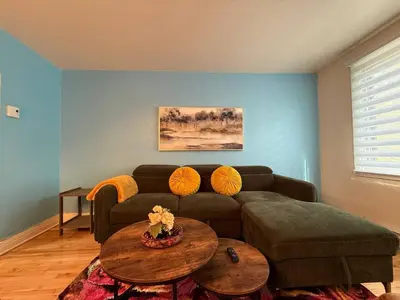 a living room with a couch and a table at Your Montreal Home Base! Free parking Free Wifi in Montréal