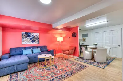 a living room with a blue couch and a table at Your Montreal Home Base! Free parking Free Wifi in Montréal
