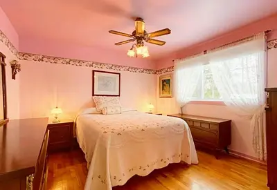a bedroom with a bed and a ceiling fan at 2beds in Room A Free parking 15min to downtown in Longueuil