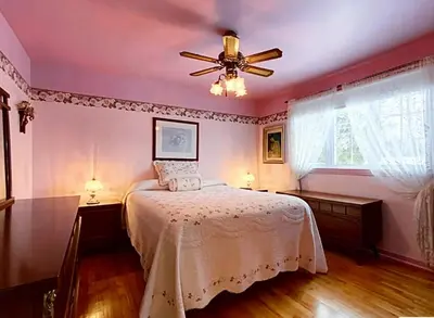 a bedroom with a bed and a ceiling fan at 2beds in Room A Free parking 15min to downtown in Longueuil