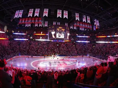 a crowd of people in an arena with a hockey rink at Free Parking! Montreal Comfort Value Convenience! Full Kitchen, Fast Wifi, Workspace, Smart TV! in Montréal