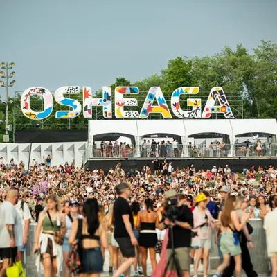 a large crowd of people walking in front of a concert at Free Parking! Montreal Comfort Value Convenience! Full Kitchen, Fast Wifi, Workspace, Smart TV! in Montréal