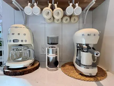 a kitchen with two coffee machines on a counter at Pur Nature Garthby et Sauna in Saint-Gérard