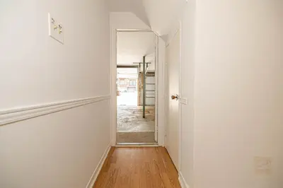 a hallway with a door leading into a room at Cozy 1 BDR apt in MTL-E, near metro, free parking in Montréal