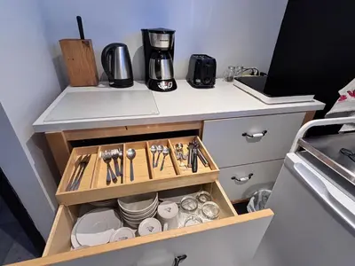 a kitchen with a coffee maker on a counter at Charmant petit studio à 15 minutes de Montréal in Longueuil