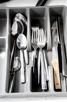 a tray filled with forks and spoons and forks at Griffintown Cozy Haven in Montréal