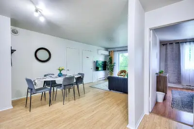 a dining room with a table and chairs at Beautiful Spacious Apartments! 6 guest Vacation home Montreal in Montréal
