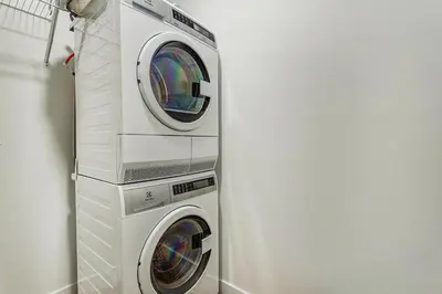 a washing machine and a dryer in a room at Montreal - Stanbrooke Galaxie - 1BR 1302 in Montréal