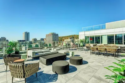 a patio with tables and chairs on a building at Montreal - Stanbrooke Galaxie - 1BR 1302 in Montréal