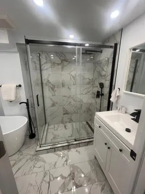 a bathroom with a shower and a sink at Cute and Cozy Studio with Private Parking in Montréal