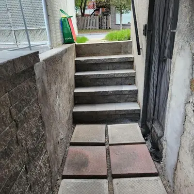 a set of stairs leading up to a building at Cute and Cozy Studio with Private Parking in Montréal