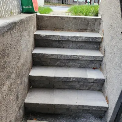 a set of concrete stairs in a building at Cute and Cozy Studio with Private Parking in Montréal