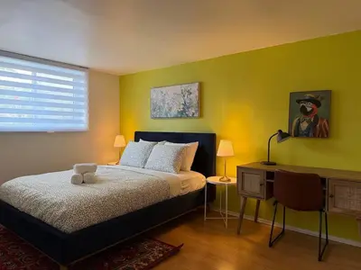 a bedroom with a bed with a teddy bear on it at Free Parking! Fast Wifi! Comfortable Apt for Montreal Explorers & Adventure! in Montréal