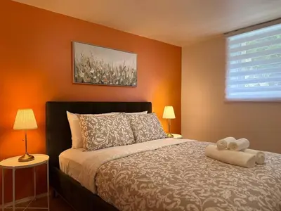 a bedroom with a bed with a teddy bear on it at Free Parking! Fast Wifi! Comfortable Apt for Montreal Explorers & Adventure! in Montréal