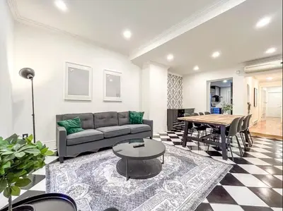 a living room with a couch and a table at Luxury 3BR - Free Parking - Washer & Dryer in Montréal