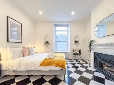 a bedroom with a bed and a fireplace at Luxury 3BR - Free Parking - Washer & Dryer in Montréal