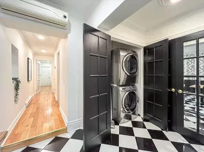 a laundry room with a washer and dryer at Luxury 3BR - Free Parking - Washer & Dryer in Montréal