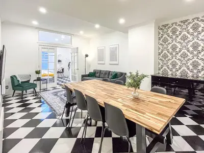 a living room with a wooden table and chairs at Luxury 3BR - Free Parking - Washer & Dryer in Montréal