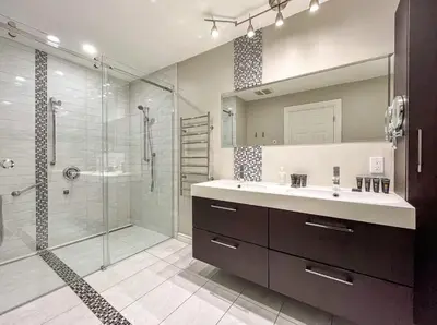 a bathroom with a sink and a glass shower at Luxury 3BR - Free Parking - Washer & Dryer in Montréal