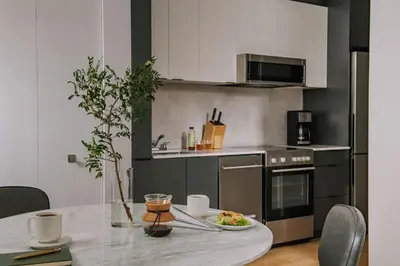 a kitchen with a table with a plate of food on it at The Alexander Hotel - Old Montreal in Montréal