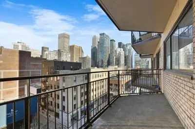 a balcony with a view of a city skyline at Luxury Downtown 1BR Residence - Urban Comfort in Montréal