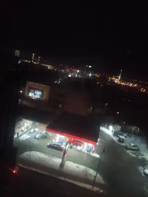 a view of a gas station at night at Atlas in Montréal